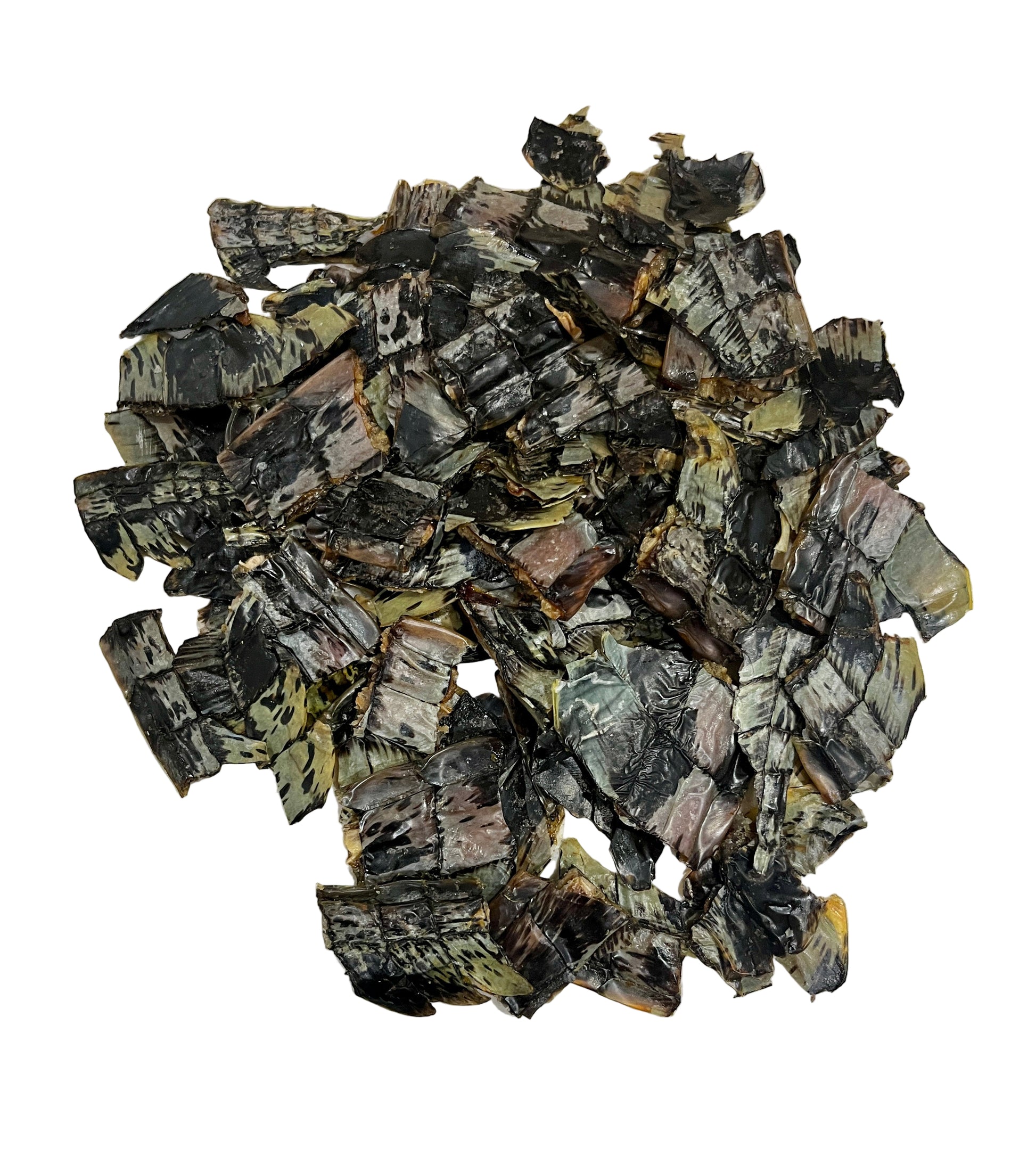 Pile of dehydrated croc crisps on a light  background. 