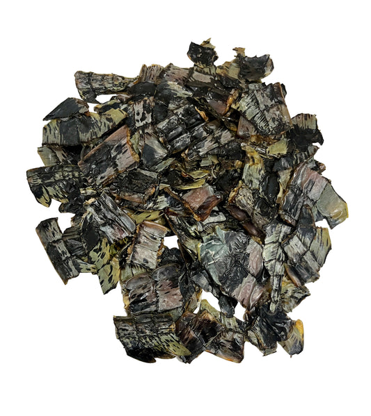 Pile of dehydrated croc crisps on a light  background. 